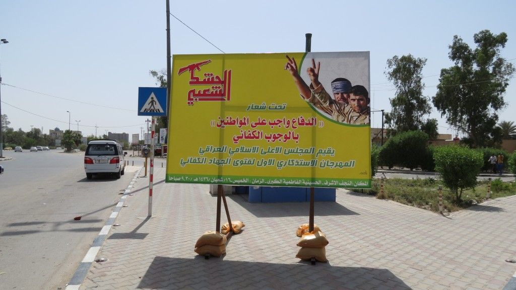 Billboard mobilizacyjny Hashd Shaabi w Nadżafie. Fot. W. Repetowicz