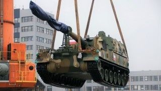 K9A1 howitzer during an unloading procedure.