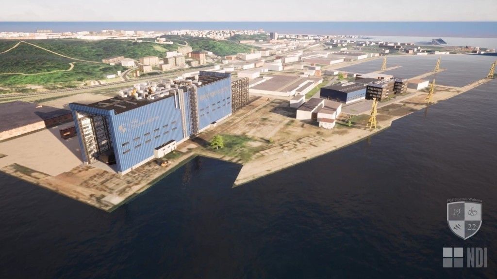 Widok na realizowane inwestycje w PGZ Stoczni Wojennej. Po lewej duża hala kadłubowa, a po lewej hala produkcyjna z budynkiem socjalno-administracyjnym.