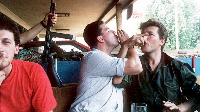 Serb soldiers toast in their stronghold in Grbavica, a distirct of Sarajevo, 1992.
Mikhail Evstafiev - Mikhail Evstafiev, CC BY-SA 3.0, https://commons.wikimedia.org/w/index.php?curid=343719