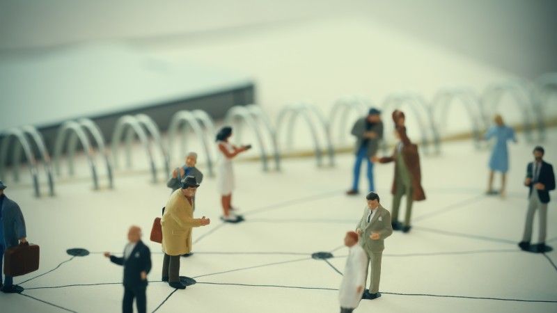 close-up-of-miniature-people-with-social-network-
