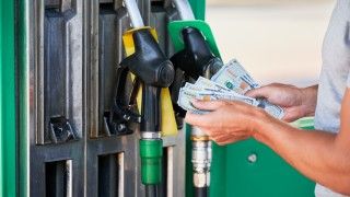 paying-for-fuel-at-a-gas-station-2026-03-17-02-24-42-utc