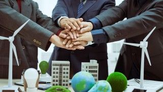three-businessmen-meet-table-to-discuss-the-devel-2026-01-08-07-53-00-utc