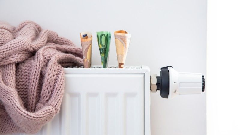 heating-cost-concept-with-scarf-and-banknotes-2026-03-19-04-30-00-utc