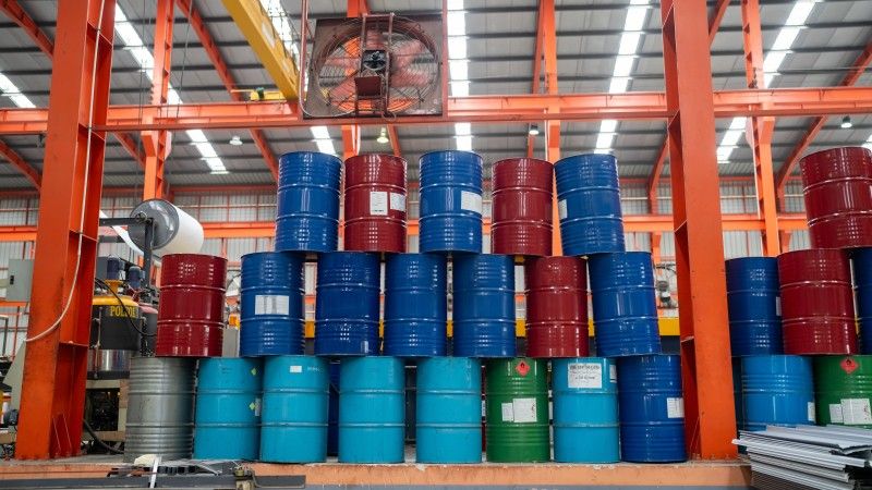 stack-of-multi-color-tanks-in-side-factory-2026-03-18-07-09-10-utc