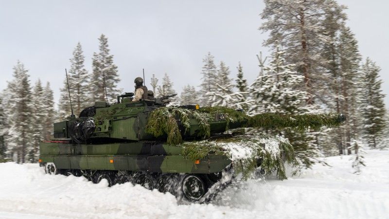 A Swedish tank drives through the thick snow as part of defence drills in Lapland, Finland. Exercise Cold Response 2026.