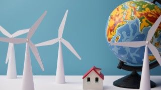 windmill-and-house-models-with-globe-on-white-tabl-2026-03-09-00-13-39-utc