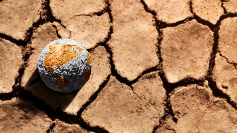 dry-earth-with-globe-symbolizing-climate-change-2026-03-25-09-20-46-utc