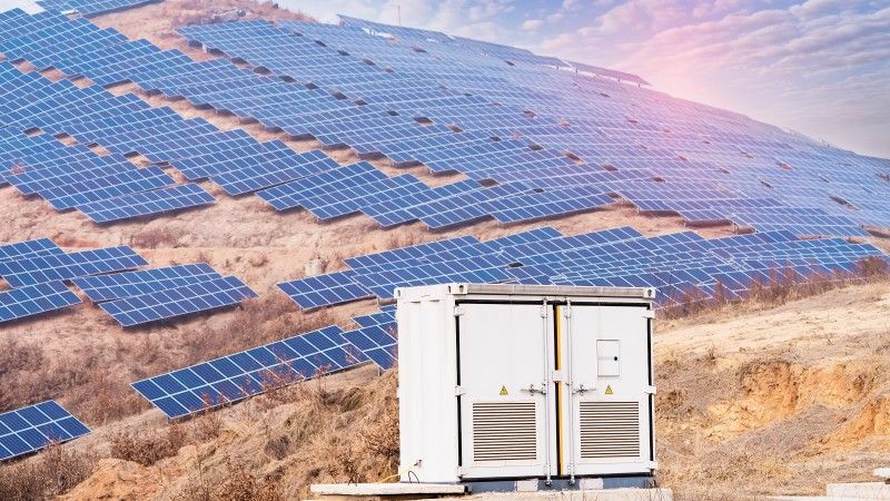 solar-panels-on-hill-with-power-storage-units-2026-04-14-04-41-09-utc