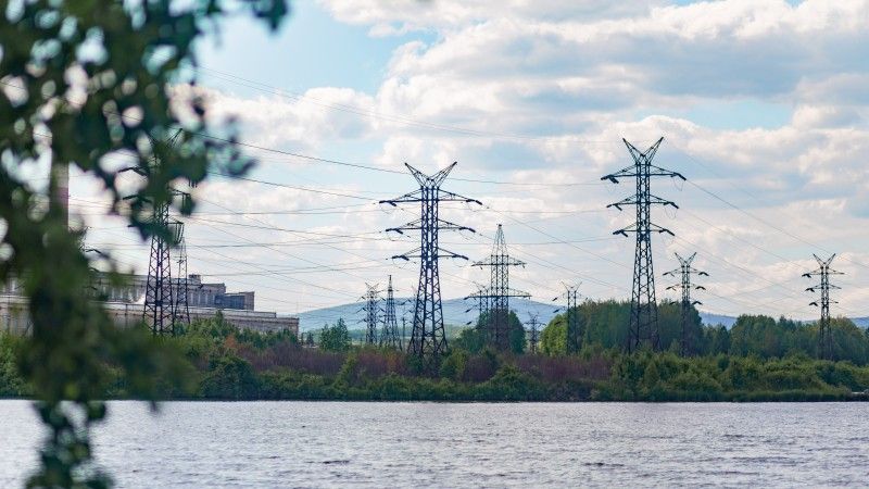 power-lines-over-water-near-industrial-building-2026-03-09-23-14-51-utc
