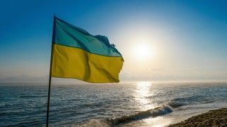 ukrainian-flag-waving-on-the-sea-shore-2026-03-16-02-29-56-utc