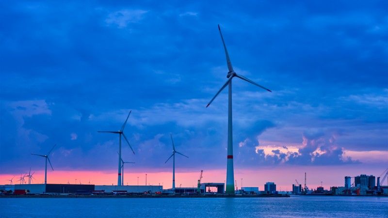 wind-turbines-against-dramatic-skies-over-water-2026-03-10-04-55-02-utc