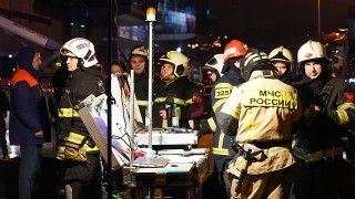 Rescuers at the scene of the terrorist attack on Crocus City Hall in Moscow.