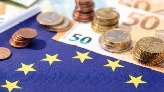 euro-coins-and-currency-with-european-union-flag-2026-03-19-05-44-00-utc
