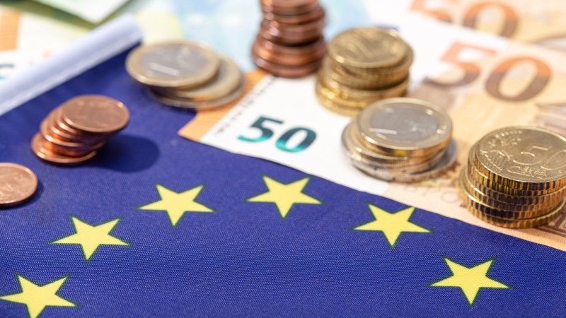 euro-coins-and-currency-with-european-union-flag-2026-03-19-05-44-00-utc