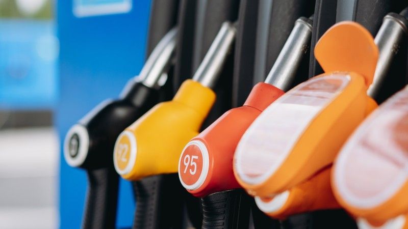 colorful-fuel-pump-handles-at-a-gas-station-2026-03-19-23-36-44-utc