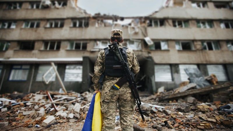 a-soldier-stands-near-a-destroyed-house-war-in-u-2026-09-22-22-16-38-utc