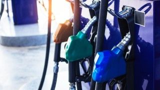 gas-pump-nozzles-at-a-service-station-2026-09-22-19-01-07-utc