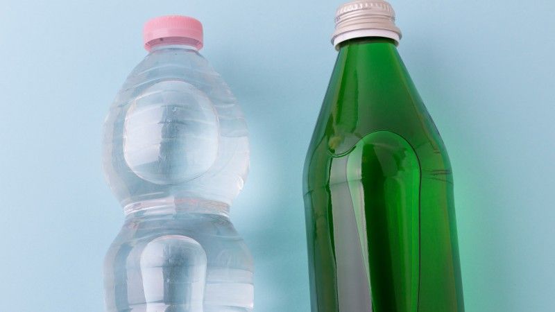 two-different-water-bottles-on-blue-background-2026-09-24-22-20-50-utc