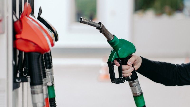 hand-holding-green-fuel-nozzle-at-gas-station-2026-09-24-07-50-26-utc